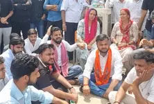 Sharda University case Family students protest against faculty two arrested