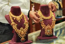 Gold prices surge to record high amid safe haven demand