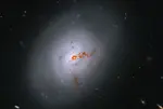 Hubble captures rare galaxy in transition image of NGC 1266, located nearly 100 million light-years away